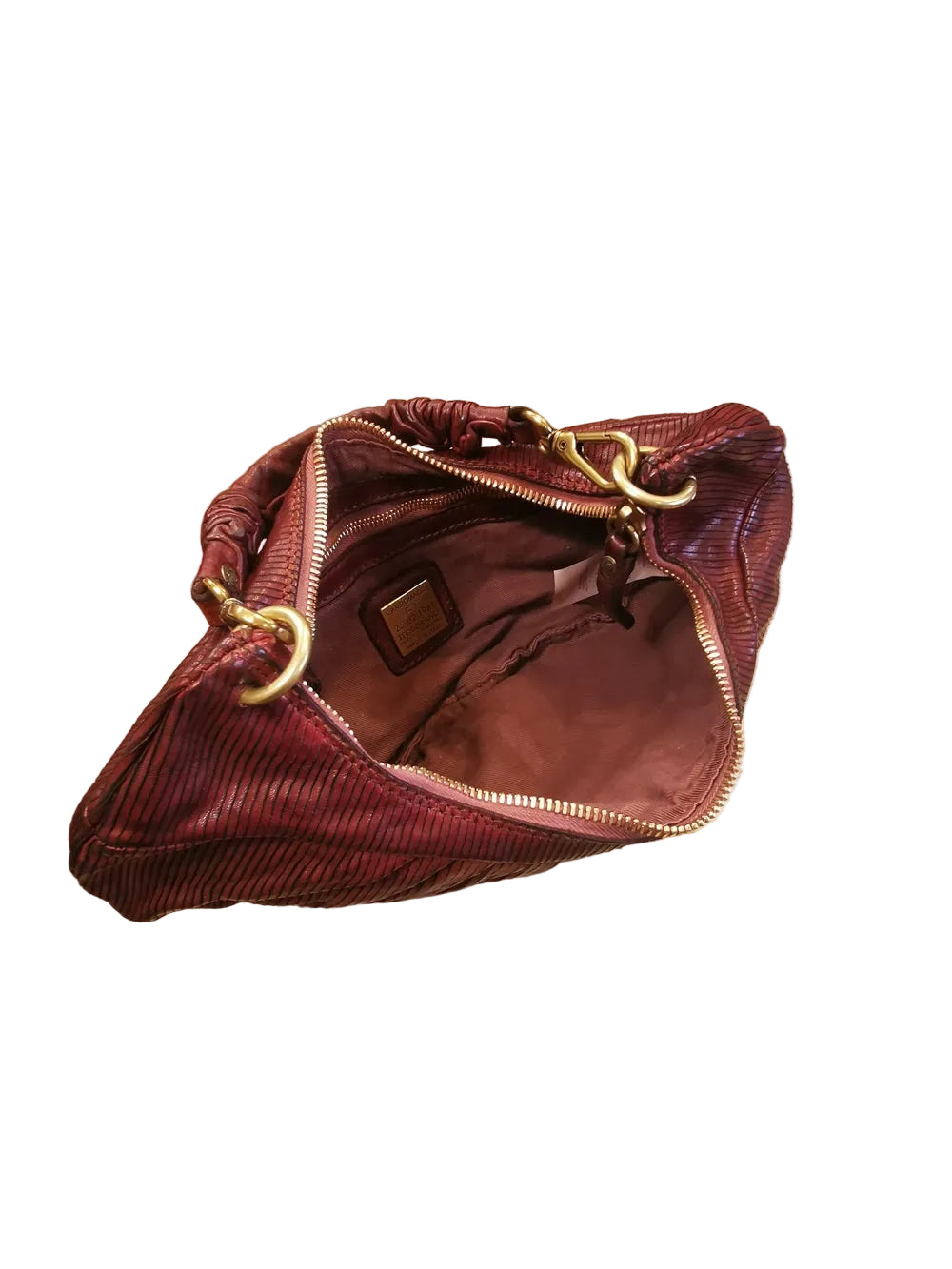 Borsa a forma di mezza luna, con una tracolla lunga e regolabile, e una piccola, entrambe staccabili e intercambiabili. Made in Italy